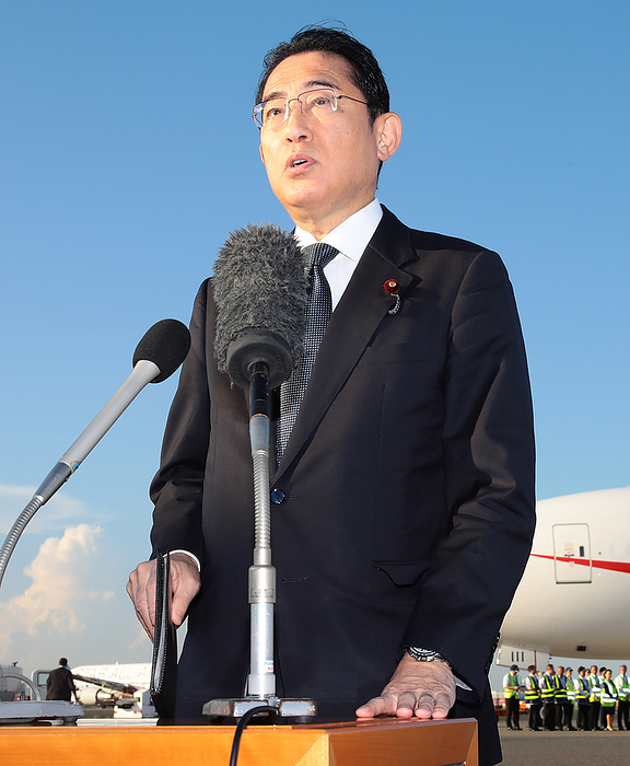 Prime Minister Kishida Departs for the U.S. Prime Minister Fumio Kishida hangs back from a government airplane for an interview at Haneda Airport on August 17, 2023.