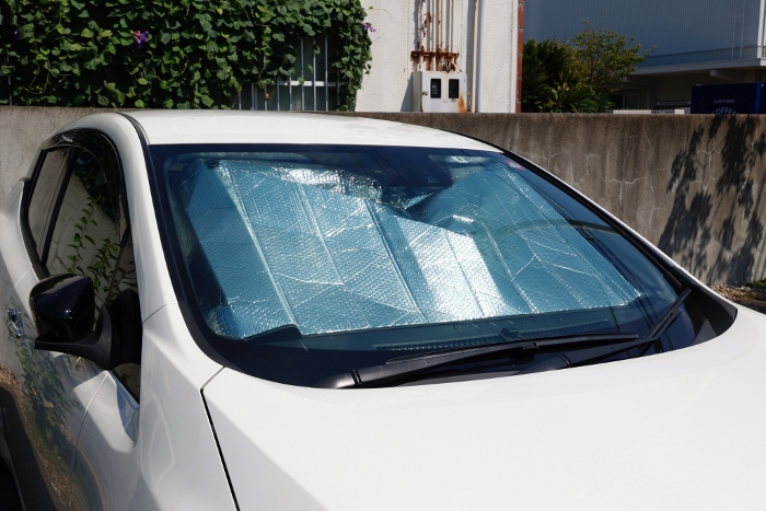 Sunshade attached to car windshield
