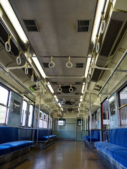 Inside a train car with an electric fan on the JR Osaka Loop Line