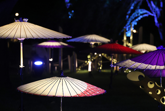 Japanese umbrellas and bamboo lanterns are illuminated for lights innstallation August 21, 2023, Tokyo, Japan   Japanese umbrellas and bamboo lanterns are illuminated by LEDs at a garden of Takanawa Prince hotel in Tokyo on Monday, August 21, 2023. The twinkling lights installation attracted summer vacationers.    photo by Yoshio Tsunoda AFLO  