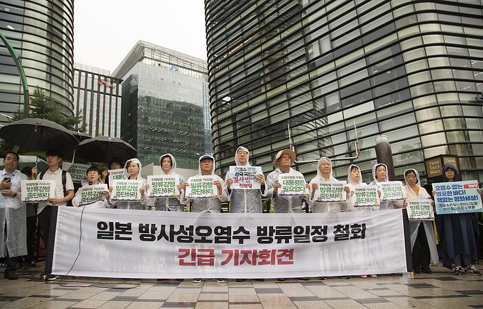 Protest in Seoul against Japan to release treated radioactive water from Fukushima plant Protest against Japanese government, Aug 23, 2023 : Kang Sung Hee  7th R , a lawmaker of the minor progressive Jinbo Party and activists from various civic groups participate in a protest to denounce Japan s decision to discharge nuclear contaminated water from the crippled Fukushima nuclear power plant into the Pacific Ocean, in front of the Japanese embassy in Seoul, South Korea. A sign  R  reads,  Clean Ocean without Nuclear contaminated Water  Nuclear free Peaceful World  and other signs read,  Japanese Prime Minister Fumio  Kishida who will be punished by Heaven, stop the enforcement of the release of nuclear contaminated water  .  Photo by Lee Jae Won AFLO   SOUTH KOREA 