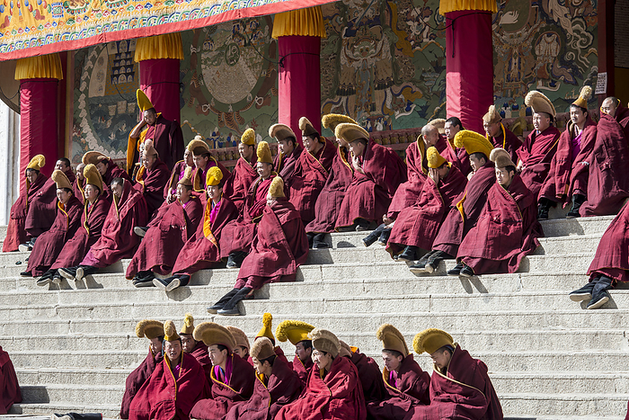 Monks in the debating courtyard at the Labrang Monastery; Labrang, Amdo, China, by Christopher Roche / Design Pics