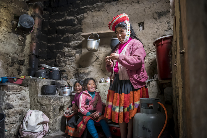 Mother with two daughters in a traditional family home in Peru; Cusco, Peru, by Christopher Roche / Design Pics