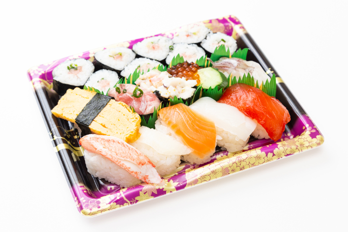 Packed sushi on white background