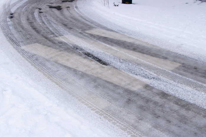 Crosswalks that are difficult to see due to snow on the road surface.