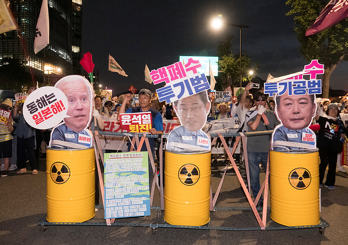South Koreans protest Japan s release of radioactive water from the crippled Fukushima nuclear power plant Protest against Japan and Yoon Suk Yeol, Aug 26, 2023 : People march in front of the Japanese embassy in Korea during a rally to protest Japan s release of radioactive water from the crippled Fukushima nuclear power plant and to denounce South Korean President Yoon Suk Yeol in Seoul, South Korea. Thousands of people attended the protest and asked for resignation of President Yoon who they insist, strings along with Japan s release of radioactive water. The Korean letters parodying on cutout portraits of the U.S. President Joe Biden, Japanese Prime Minister Fumio Kishida and South Korean President Yoon  L R  read, The East Sea of Korea is the Sea of Japan  ,  Criminal of dumping nuclear contaminated water  and  Accomplice of dumping nuclear contaminated water .  Photo by Lee Jae Won AFLO   SOUTH KOREA 