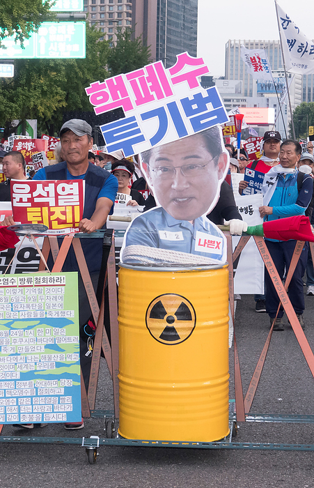 South Koreans protest Japan s release of radioactive water from the crippled Fukushima nuclear power plant Protest against Japan and Yoon Suk Yeol, Aug 26, 2023 : People march during a rally to protest Japan s release of radioactive water from the crippled Fukushima nuclear power plant and to denounce South Korean President Yoon Suk Yeol in Seoul, South Korea. Thousands of people attended the protest and asked for resignation of President Yoon who they insist, strings along with Japan s release of radioactive water. The Korean letters parodying on a cutout portrait of Japanese Prime Minister Fumio Kishida read, Criminal of dumping nuclear contaminated water . Pickets read,  Yoon Suk Yeol Resign  .  Photo by Lee Jae Won AFLO   SOUTH KOREA 