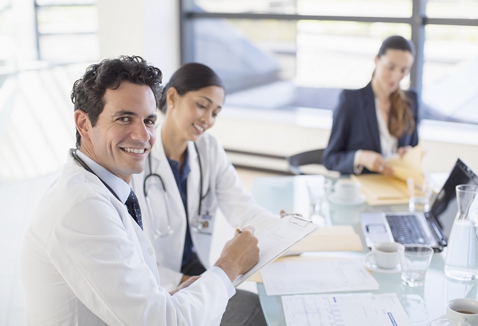 Business people in a meeting Portrait of smiling doctor in meeting