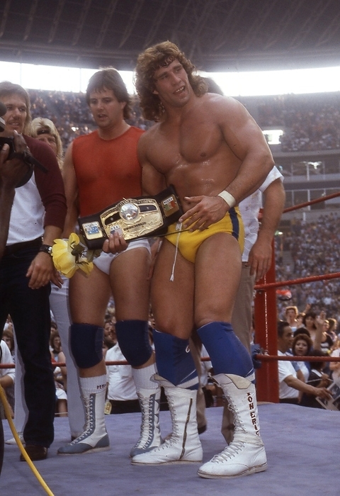 1984 U.S.A. Professional wrestling 19840506, Foreign Wrestling, Memorial match for the late David Von Erich, Kerry Von Erich is congratulated by Chris Adams, Buck Zumoff and others after defeating Ric Flair for the NWA World Heavyweight Title at Irvin Texas Stadium, Texas, USA.