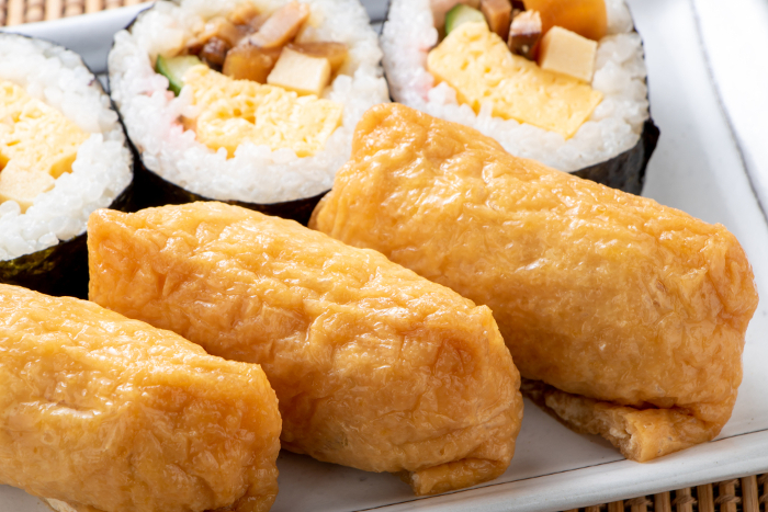 A close-up of inari sushi (inari sushi from Sukeroku Sushi).