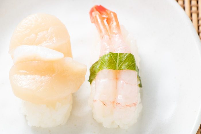 Nigiri sushi. Amaebi and scallop.