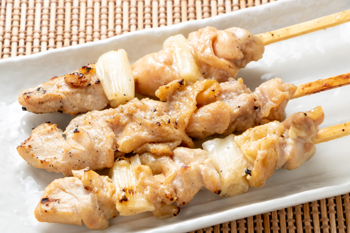 Yakitori. Negima and chicken thigh, grilled with salt.