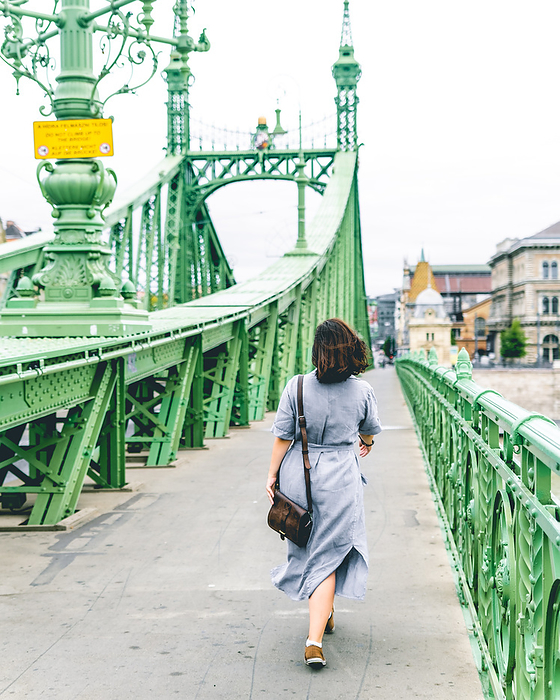 Girl walking on the Liberty Bridge Budapest
