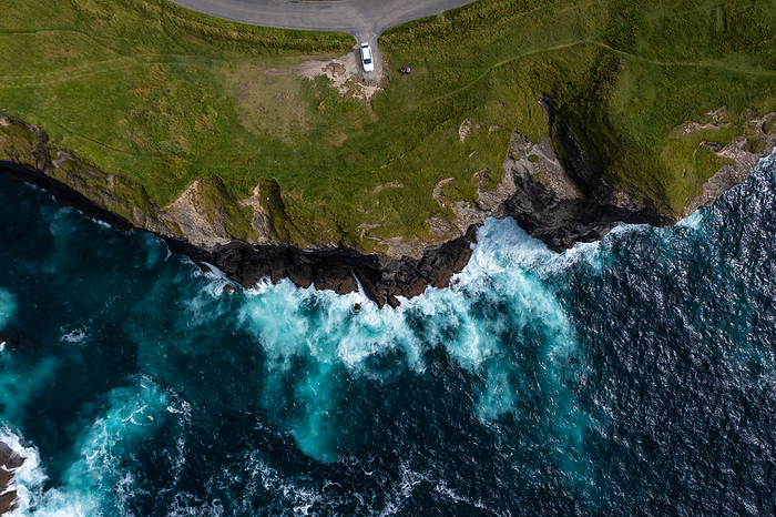 Birds eye view of car parked at Cliff in Ireland