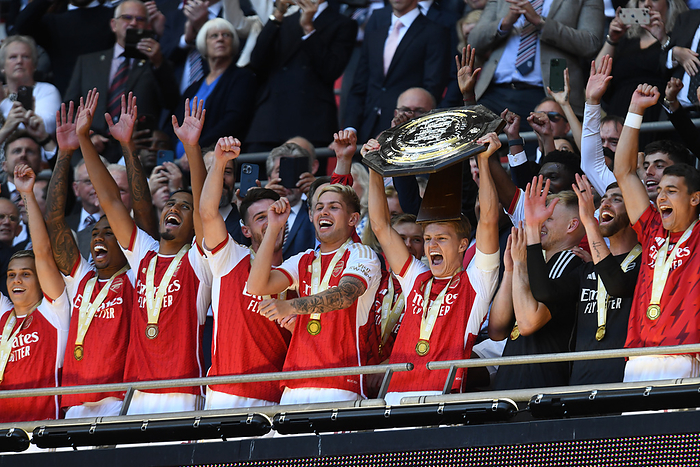 Manchester City v Arsenal   The FA Community Shield Teammates and Martin Odegaard of Arsenal lifts the trophy after The FA Community Shield match between Manchester City and Arsenal at Wembley Stadium on August 6, 2023 in London, England.   WARNING  This Photograph May Only Be Used For Newspaper And Or Magazine Editorial Purposes. May Not Be Used For Publications Involving 1 player, 1 Club Or 1 Competition Without Written Authorisation From Football DataCo Ltd. For Any Queries, Please Contact Football DataCo Ltd on  44  0  207 864 9121