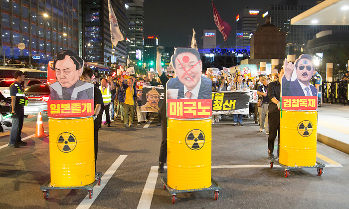 South Koreans protest Japan s release of radioactive water and demand resignation of South Korean President Yoon Suk Yeol at a rally in Seoul Protest against Japan and Yoon Suk Yeol, Sep 9, 2023 : People attend a rally to protest Japan s release of radioactive water from the crippled Fukushima nuclear power plant and to demand resignation of South Korean President Yoon Suk Yeol in Seoul, South Korea. Thousands of people at the rally insisted Yoon strings along with Japan s release of radioactive water. Japan began discharging the radioactive water into the ocean on August 24, which has been stored at the nuclear power plant since three nuclear reactors melted down in the wake of an earthquake in March 2011, according to news reports. Korean letters on disgraced portraits of Yoon read,  L R   Pawn of Japan ,  Traitor to South Korea  and  Dictatorship by the prosecution .  Photo by Lee Jae Won AFLO   SOUTH KOREA 