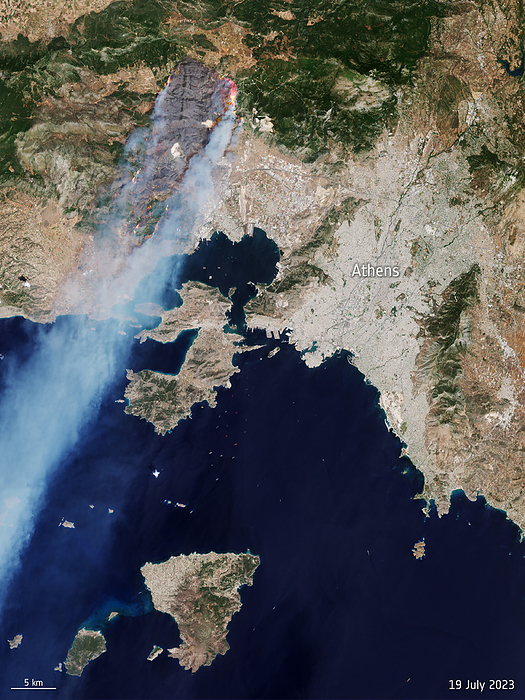 Wildfires, Athens, Greece, July 2023 Flames and smoke from wildfires in Dervenochoria, northwest of Athens, Greece, on 19th July 2023. The fires had been burning for three days after southern Europe experienced a heatwave with temperatures in excess of 40 degrees Celsius. Strong winds spread the fires, leading to mass evacuations as they approached nearby homes and towns. Data obtained by the Copernicus Sentinel 2 satellite., by EUROPEAN SPACE AGENCY SCIENCE PHOTO LIBRARY