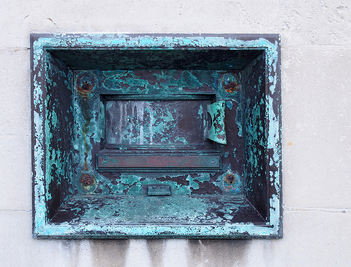 an old metal outdoor overnight deposit box also known as a night safe, once common on the outside walls of banks On Old Metal Outdoor Overnight Deposit Box so Known as a Night Safe, Once Common on the Outside Walls of Banks, by Zoonar PHILIP_OPENSH