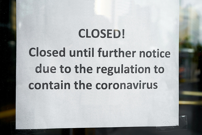 Sign on the front door of a closed hotel in Berlin during the Corona pandemic Sign on the Front Door of a Closed Hotel in Berlin During the Corona Pandemic, by Zoonar Heiko Kueverl