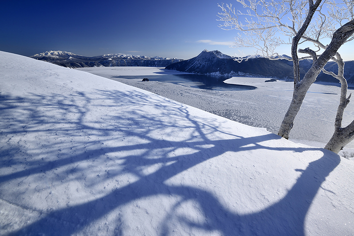 Lake Mashu in the Shadow of Trees and Frozen Lake Mashu Hokkaido At Lake Mashu, Teshikaga
