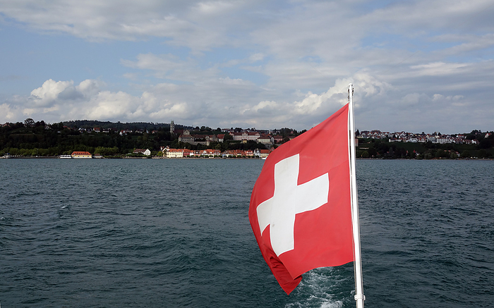 Swiss flag on a ship on Lake Constance Swiss Flag on a Ship on Lake Constance, by Zoonar Volker Rauch