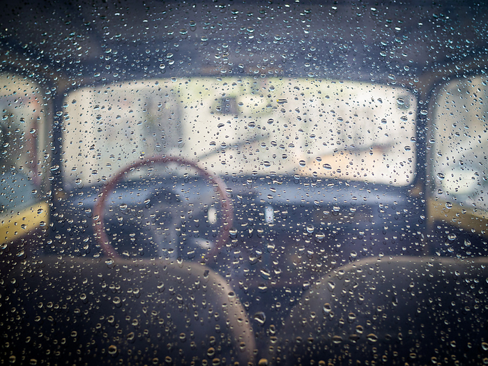 Rear window view into a classic oldtimmer with raindrops Rear Window View Into a Classic Oldtimmer with Raindrops, by Zoonar Ewald Fr