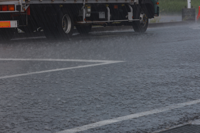 Heavy rain beating down on the asphalt