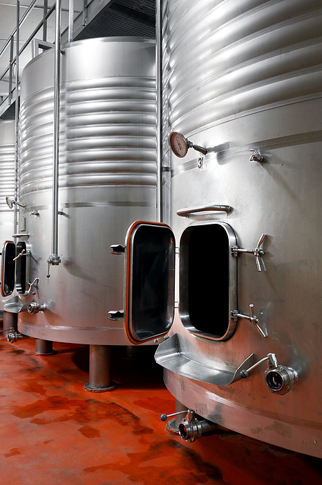 Industrial stainless steel vats in modern brewery. Industrial Stainless Steel Vats in Modern Brewery., by Zoonar DAVID HERRAEZ