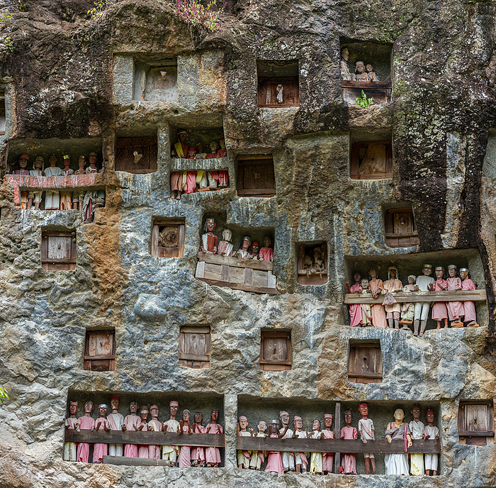 The rock tombs and galleries with Tau Tau of Lemo are a main attraction in Tana Toraja The Rock Tombs and Galleries with Tau Tau of Lemo Are A Main Attraction in Tana Toraja, by Zoonar Stefan Laws