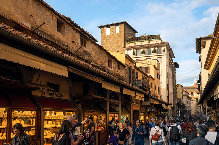 FLORENCE, TUSCANY ITALY   OCTOBER 18 : View of buildings and people on Ponte Vecchio bridge in Florence on October 18, 2019. Unidentified people. Florence, Tuscany Italy   October 18: View of Buildings and People on Ponte Vecchio Bridge in Florence on October 18, 2019. Unidetified People., by Zoonar Phil Bird