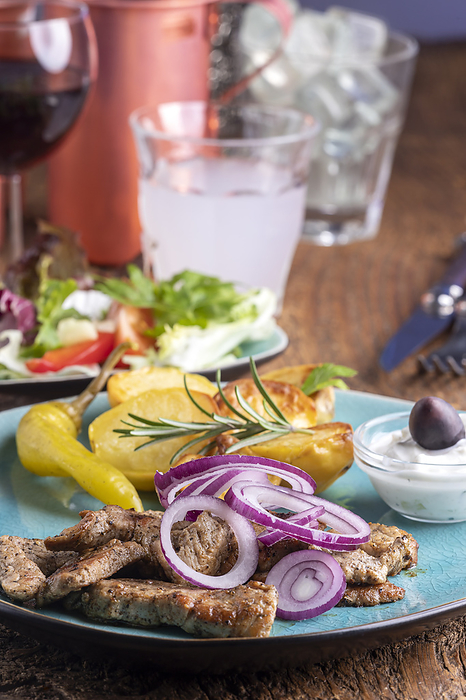 Greek gyros with salad and ouzo Greek Gyros with Salad and Ouzo, by Zoonar Bernd Juergen
