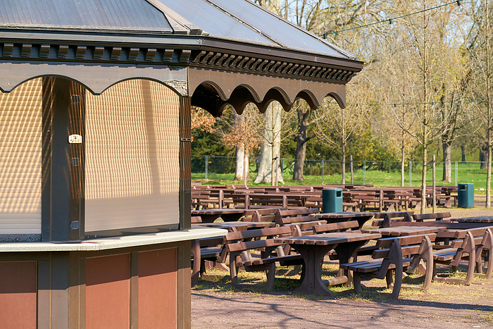 closed outdoor restaurant during a lockdown during the Corona pandemic in a park in Germany Closed Outdoor Restaurant During A Lockdown During the Corona Pandemic in A Park in Germany, by Zoonar Heiko Kueverl