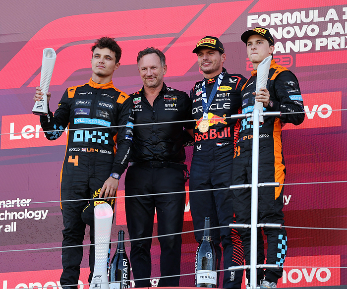 2023 F1 Japan GP Podium Ceremony On the podium of the Japanese GP, from left, Lando Norris of McLaren in second place, Red Bull team principal Christian Horner, winner Max Verstappen, and Oscar Piatri of McLaren in third place at Suzuka Circuit on September 24, 2023 photo date 20230924 photo location  Suzuka Circuit