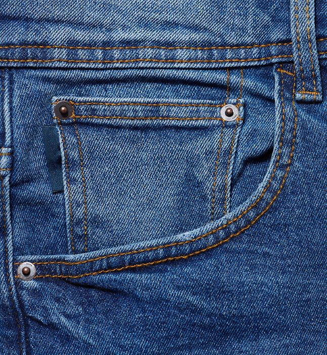 Blue jeans front pocket with buttons, close up Blue jeans front pocket with buttons, close up