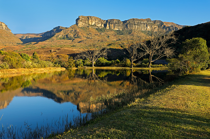 Sandstone mountains and pond with reflection in water Sandstone mountains and pond with reflection in water, by Zoonar Nico Smit