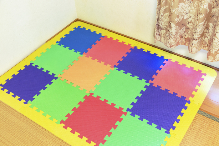 Colorful play mats in the room