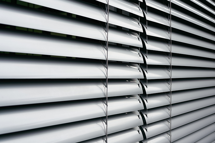 Blinds as sun protection on the window of an office building in Berlin in germany Blinds as sun protection on the window of an office building in Berlin in germany, by Zoonar HEIKO KUEVERL