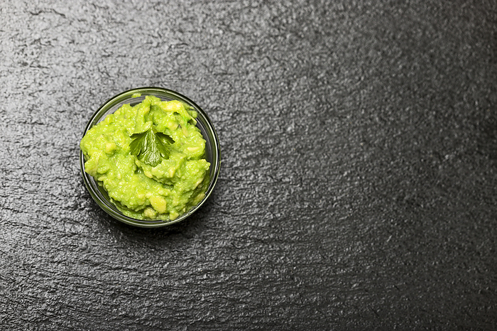 small portion of guacamole on slate small portion of guacamole on slate, by Zoonar Bernd Juergen