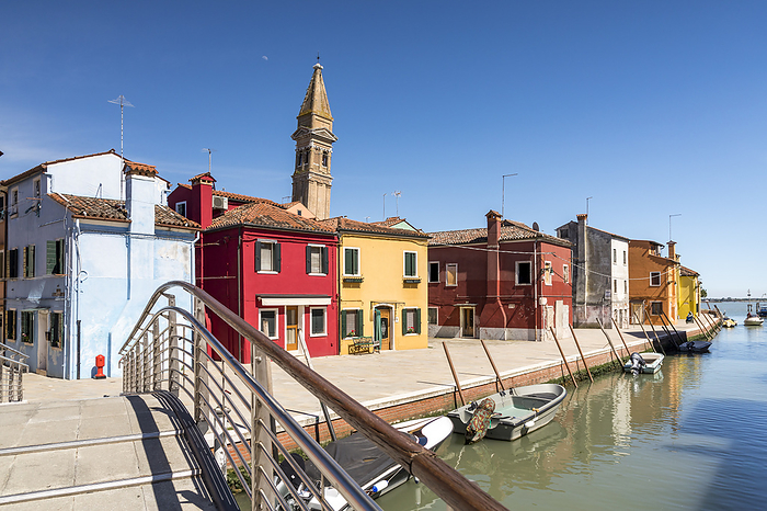 Colorful houses with the leaning tower in the city center of the island of Burano near Venice Colorful houses with the leaning tower in the city center of the island of Burano near Venice, by Zoonar Gerald Lechne