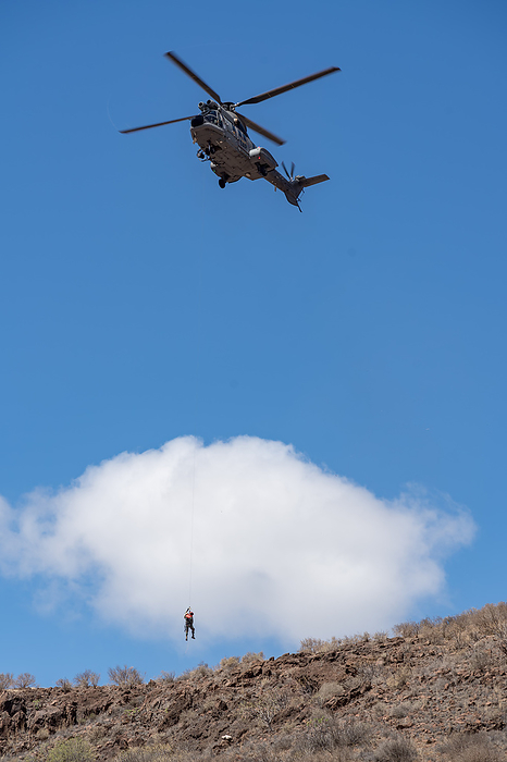 VENEGUERA, GRAN CANARIA, CANARY ISLANDS, SPAIN   MARCH 10 : Rescue helicopter training near Venguera, Gran Canaria on March 10,  2022. One unidentified person VENEGUERA, GRAN CANARIA, CANARY ISLANDS, SPAIN   MARCH 10 : Rescue helicopter training near Venguera, Gran Canaria on March 10,  2022. One unidentified person, by Zoonar Phil Bird