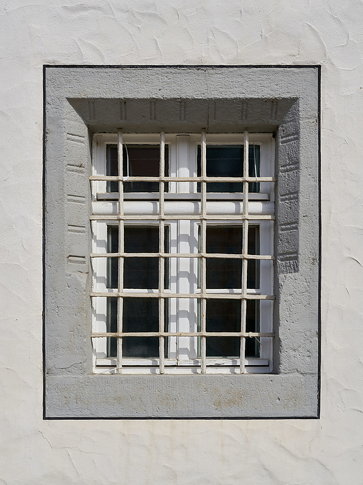 single window with window grille in the old town of Wittenberg in Germany single window with window grille in the old town of Wittenberg in Germany, by Zoonar Heiko Kueverl