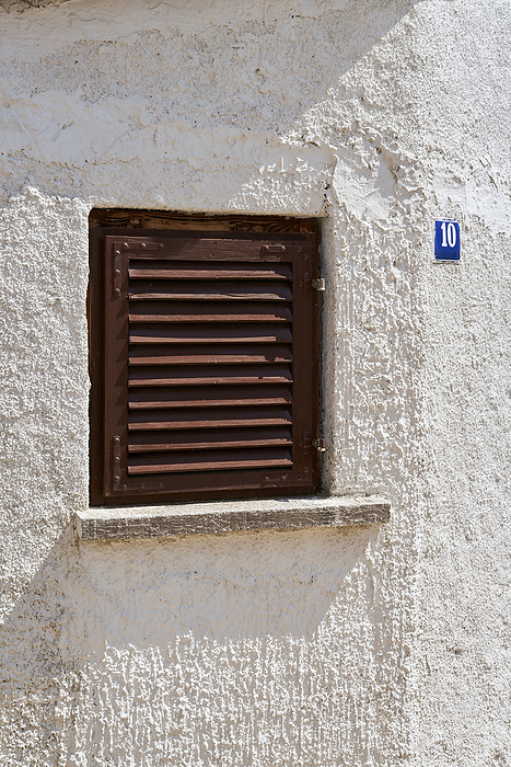 single window with shutter in the old town of Krk in Croatia single window with shutter in the old town of Krk in Croatia, by Zoonar Heiko Kueverl