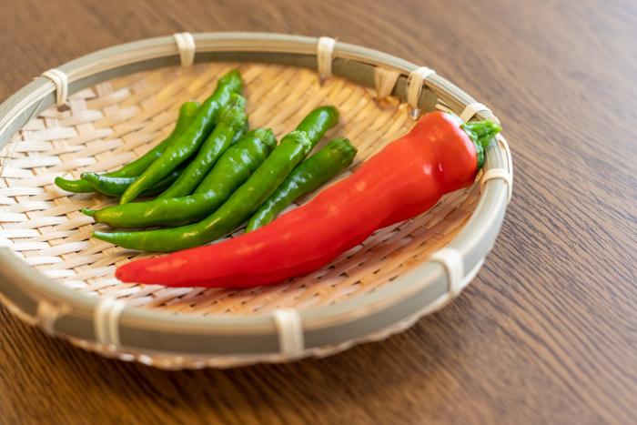 Chili pepper on bamboo colander