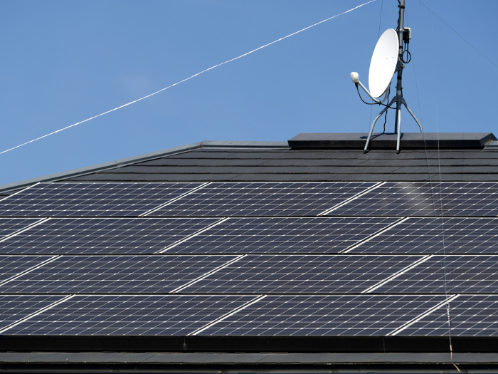 Solar panels on roof and TV antenna
