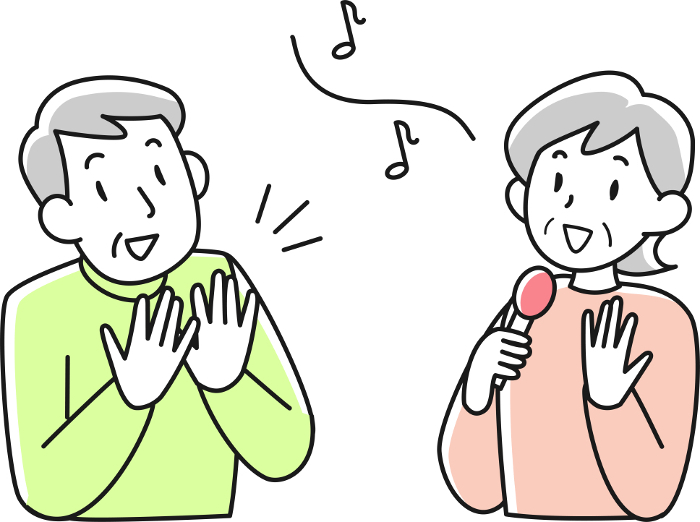 Senior woman singing and senior man clapping hands