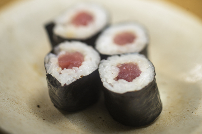 vinegared rice and sliced raw tuna wrapped in seaweed
