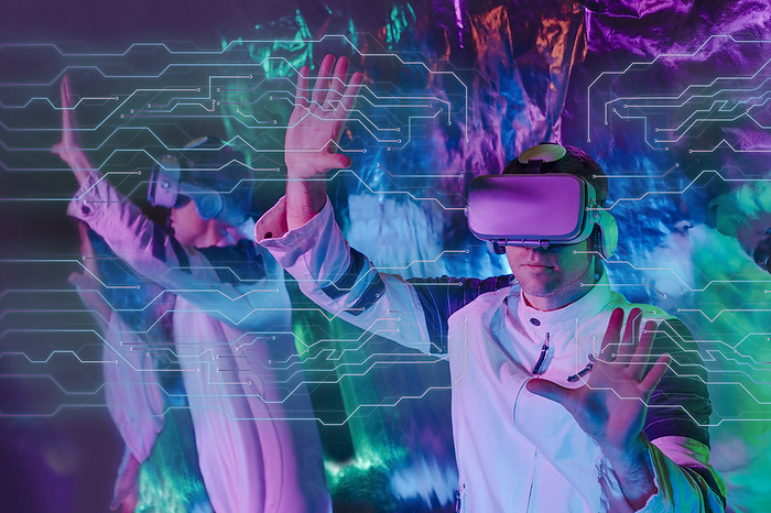 Man wearing virtual reality simulator touching transparent screen