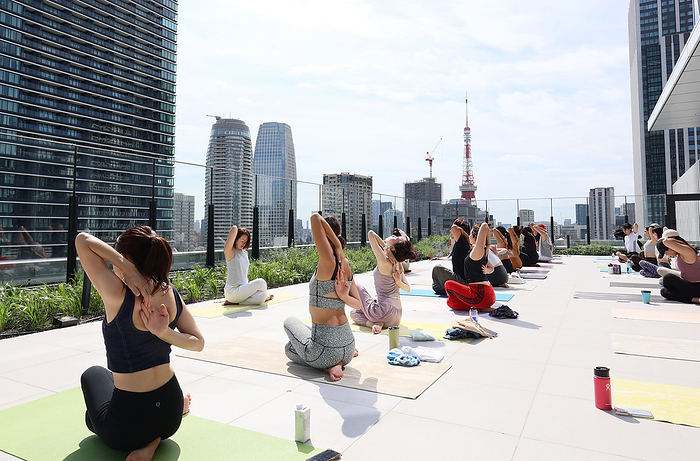 Toranomon Hills Station Tower is displayed for press October 2, 2023, Tokyo, Japan   Models demonstrate yoga lesson on the eighth floor balcony of the newly built Toranomon Hills Station Tower which connct to subway stations at a press preview in Tokyo on Monday, October 2, 2023. The Toranomon Hills Station Tower will officially open on October 6.   photo by Yoshio Tsunoda AFLO 