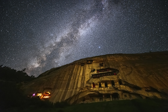 Milky Way above Mati Temple, Gansu, China Milky Way above the Mati Temple in Gansu, China. The Milky Way is our galaxy seen from the inside. It appears as a hazy band of stars and nebulae stretching across the sky. Photographed on 31 July 2019., by JEFF DAI   SCIENCE PHOTO LIBRARY