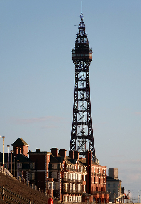 view of blackpool tower from the promenade with town buildings in afternoon sunlight view of blackpool tower from the promenade with town buildings in afternoon sunlight, by Zoonar Philip Opensh